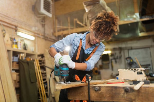 A skilled craftsperson repurposing furniture.