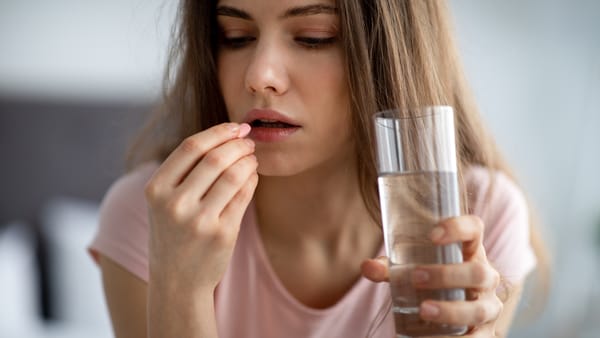 A single woman taking antidepressants.